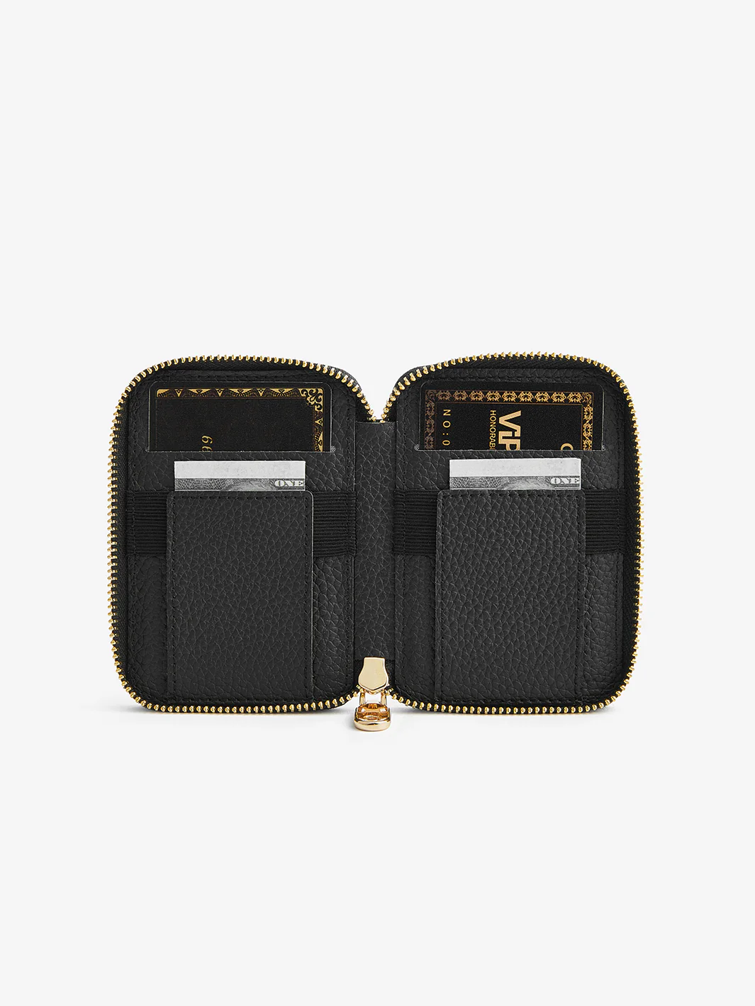 Black pebbled leather zip-around wallet open, showing card slots and two inner compartments with gold hardware.